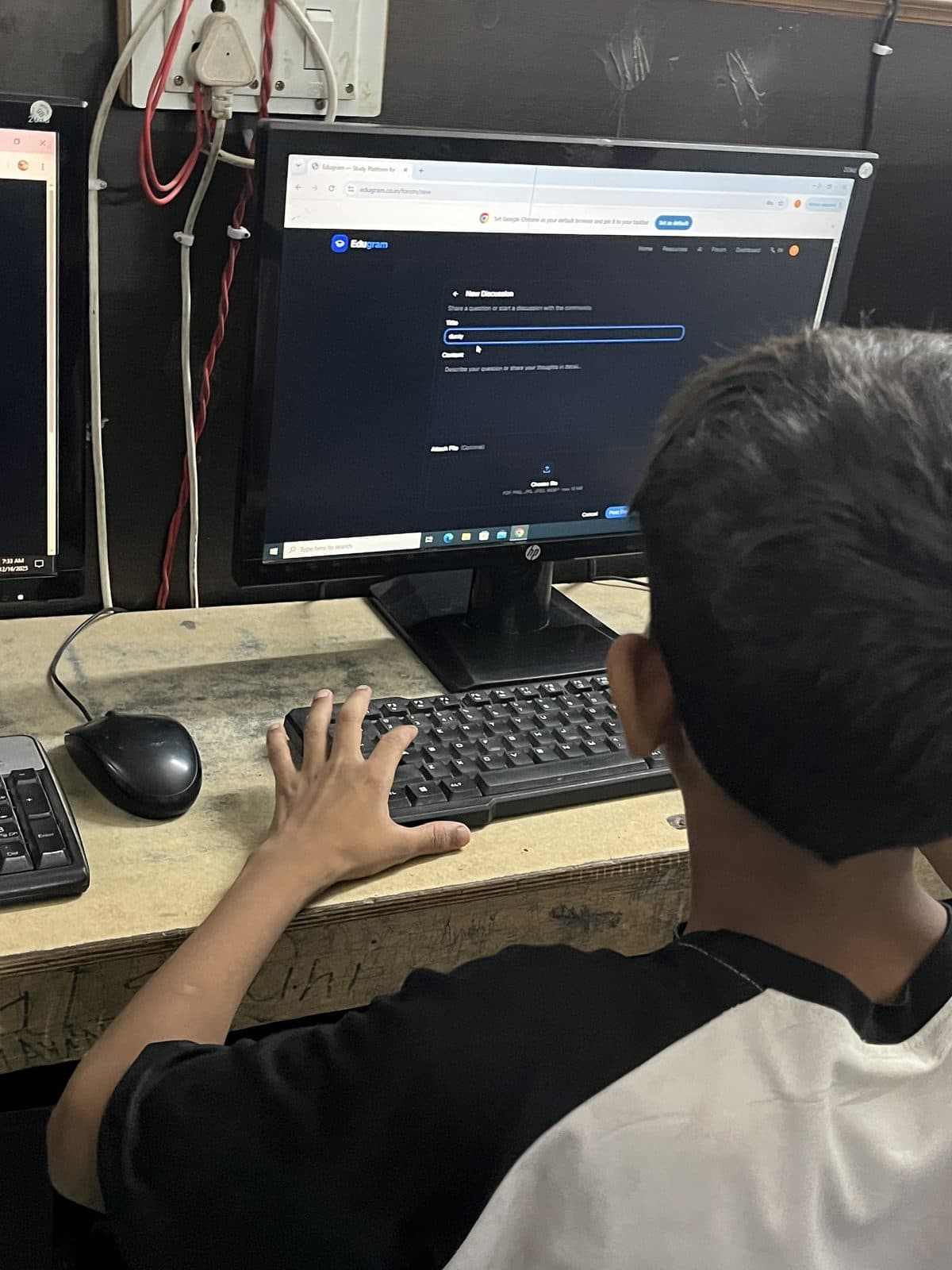 A student at Prayatna using the Edugram site on a desktop computer, the page open on screen.